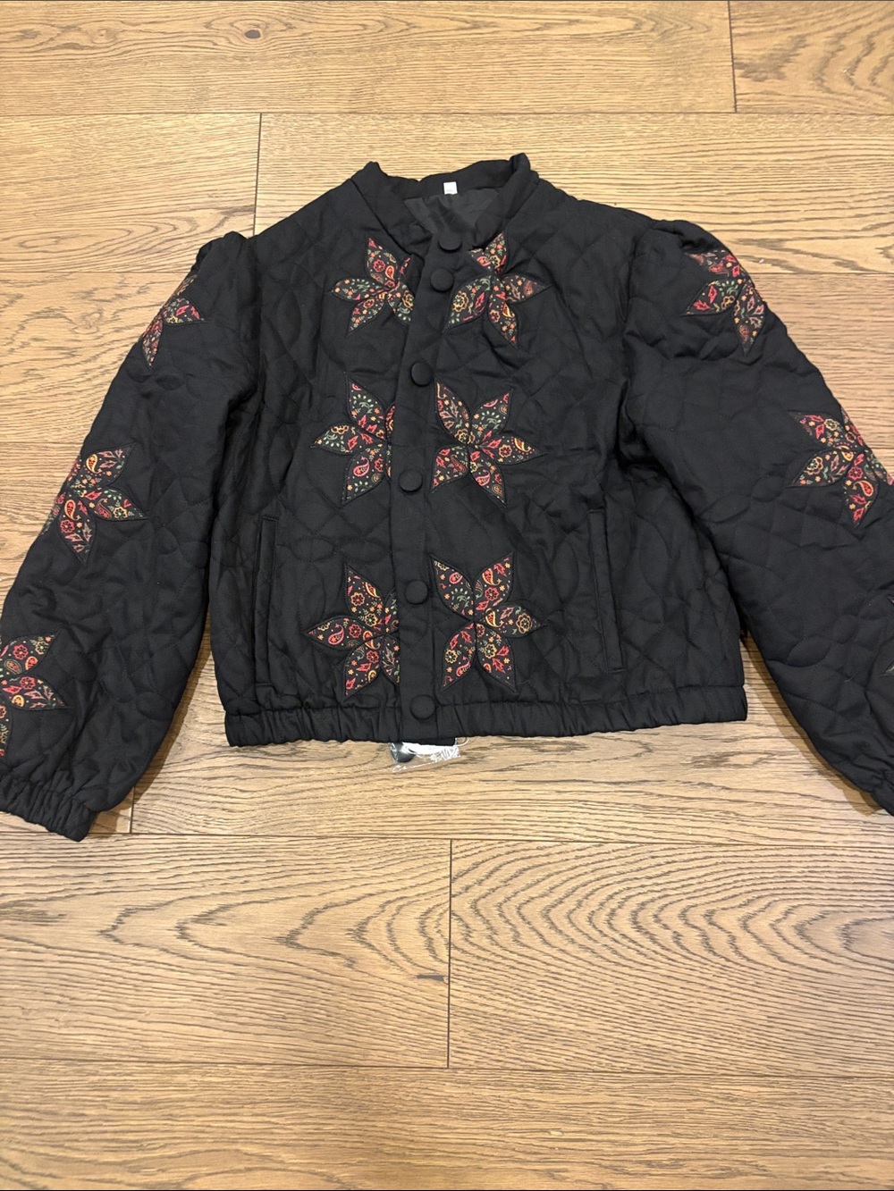 Amazon Black Quilted Puffer Jacket with Red and Tan Floral Embroidery